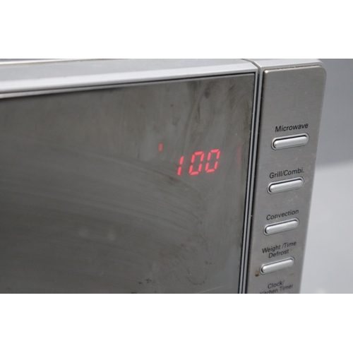 522 - A Stainless Steel 25l Combination Mirowave (MC2514), With Magnetic Timer. Microwave Powers On When T... 