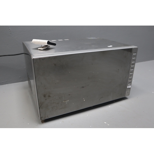 522 - A Stainless Steel 25l Combination Mirowave (MC2514), With Magnetic Timer. Microwave Powers On When T... 