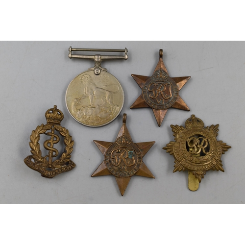 282 - Three WWII Military Medals (Defence Medal and Two 1939-45 Stars), And Two Cap Badges (Royal Army Med... 