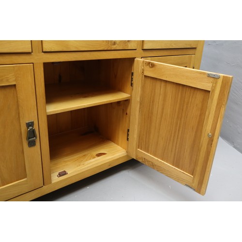 586 - Stunning Solid Oak Three drawer Three Cupboard Sideboard Unit Dressed with Bronze Effect Dropdown Ha... 