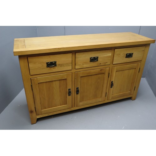 586 - Stunning Solid Oak Three drawer Three Cupboard Sideboard Unit Dressed with Bronze Effect Dropdown Ha... 