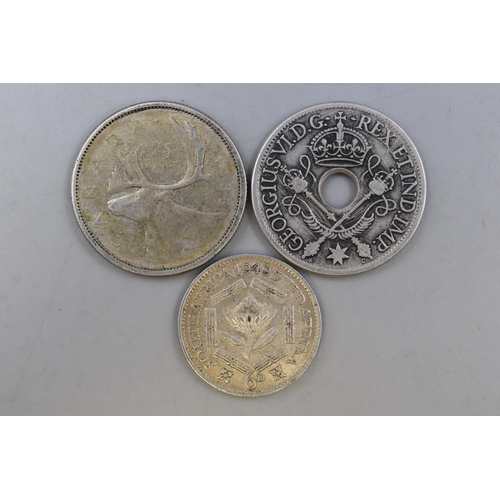 141 - Three Foreign Silver Coins