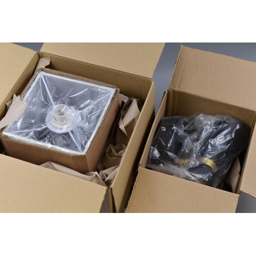 630 - Two Boxed Light Fittings and Boxed Table Lamp. Includes Grey Speckle Table Lamp, Diablo Black and Go... 