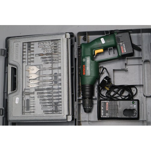 654 - Two Items to include a Cased Bosch PSB 9,6 VES-2 Cordless Drill complete with Charger untested and a... 