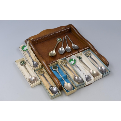 386 - A Selection of Twelve Golf Themed Silver Plated Collectors Teaspoons, With Wall Hanging Display Rack