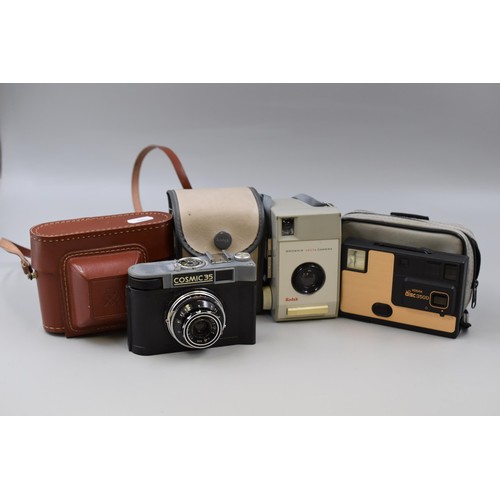 417 - Three Vintage Cameras including Kodak Disc 3500 with Case, Kodak Brownie with Case and a Cosmic 35 w... 