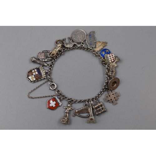 25 - A Sterling Silver Charm Bracelet, With Approx 18 Silver Charms