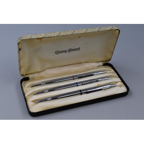 40 - A Set of Three Conway Stewart Ball Point Pens, In Presentation Case. Red, Blue and Black