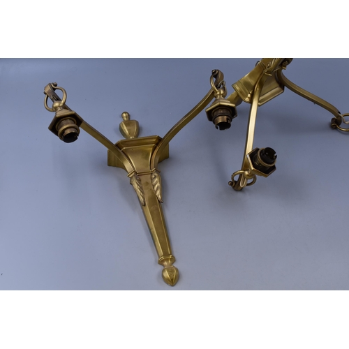 333 - Two brass made in England wall light mounts with twin light fittings on each