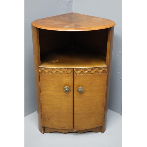 530 - Teak tear drop shaped corner unit with single self and cupboard space (29