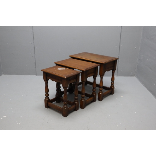 582 - Triple nest of dark wooded tables (17