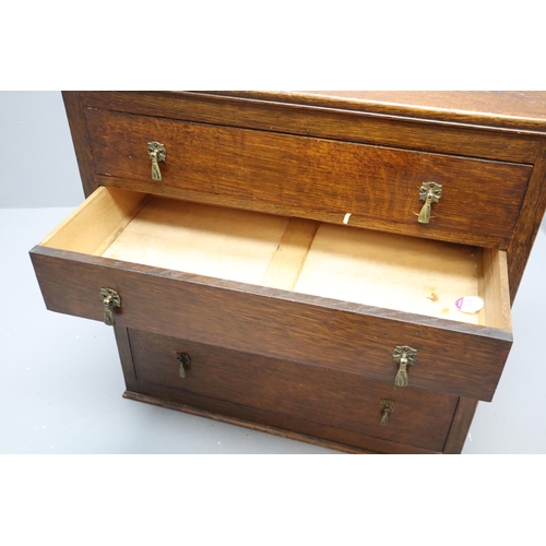 585 - Vintage Four Drawer Bedroom Unit Dressed with Brass Dropdown Handles topped off with a Hand carved S... 