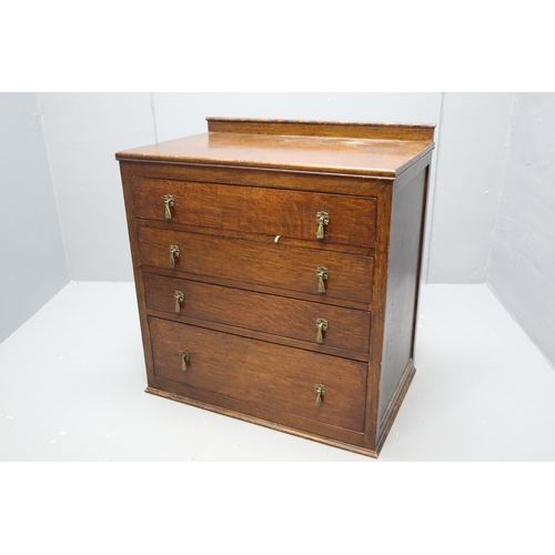 585 - Vintage Four Drawer Bedroom Unit Dressed with Brass Dropdown Handles topped off with a Hand carved S... 