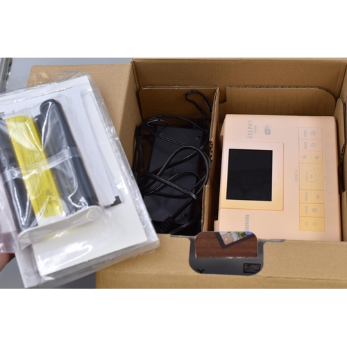 504 - Two Boxed Compact Photo Printers To Include Canon Selphy (CP1300), And HP Invent Photosmart 335. Unt... 