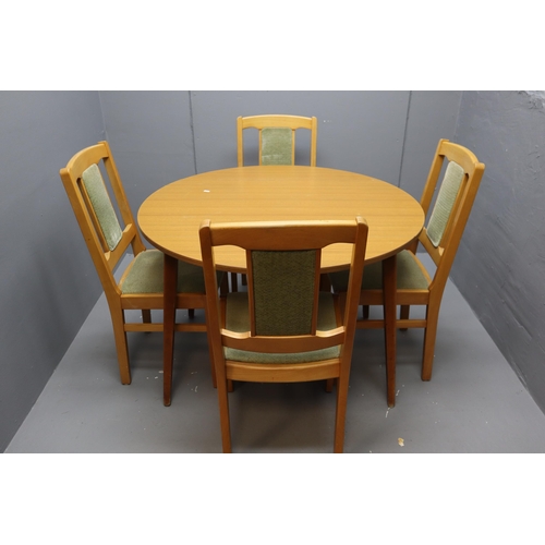 569 - A teak drop leaf table with a set of four chairs with a green seat and back rest. Dimensions of tabl... 