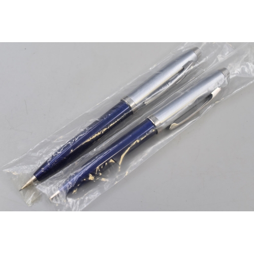 63 - A Cased Sheaffer Ball Point Pen and Mechanical Pencil Set, In Blue and Brushed Metal