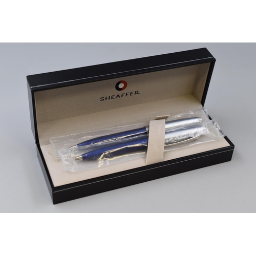 63 - A Cased Sheaffer Ball Point Pen and Mechanical Pencil Set, In Blue and Brushed Metal