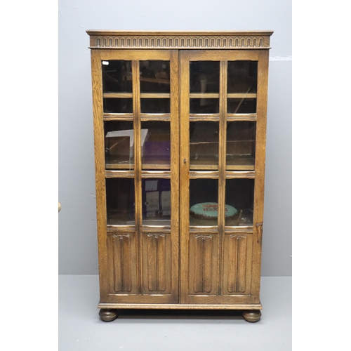 588 - Antique dark wooden display unit with two shelves and storage space at the bottom (53