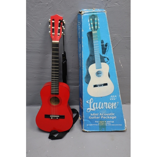 591 - Lauren Red mini acoustic guitar it has a adjustable bridge it includes a guitar bag, pitch pipe and ... 