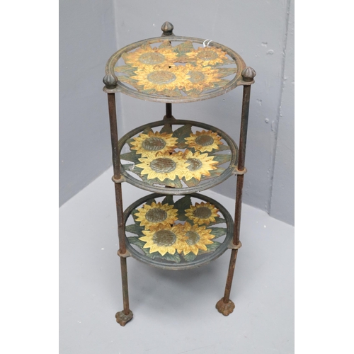 679 - A Cast Iron Kitchen Pan Stand Depicting Sunflowers. Approx 25