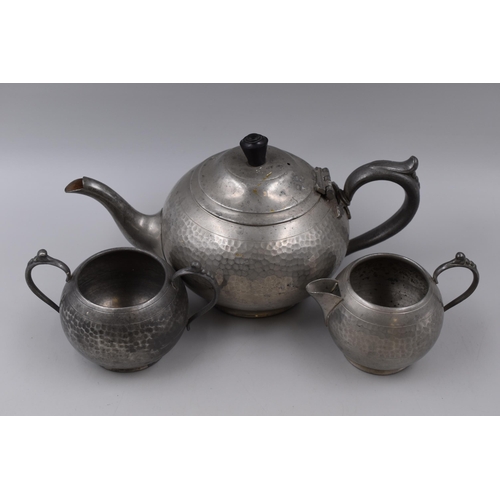 416 - A Vintage Three Piece Beaten Pewter Tea Service (Teapot, Milk Jug, Sugar Bowl)