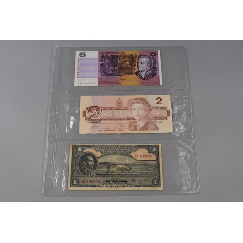 147 - Three Bank Notes including Australian $5, Canada $2 and Ethiopian $1