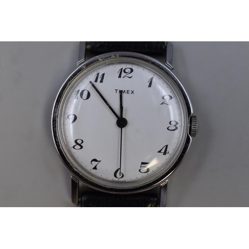 79 - Timex mechanical watch with white face and black leather strap working