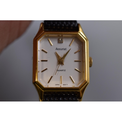 97 - An Accurist Gold Tone Clear Stoned Ladies Quartz Watch, In Presentation Box. Working