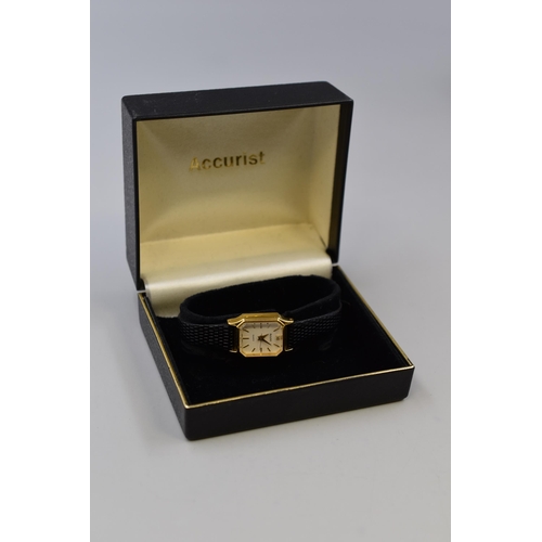 97 - An Accurist Gold Tone Clear Stoned Ladies Quartz Watch, In Presentation Box. Working