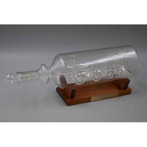 286 - A glass model of Stephensons rocket in a bottle