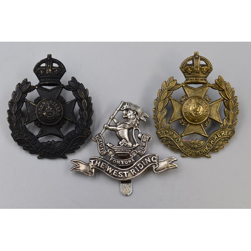 313 - Three Military Cap Badges including Duke of Wellingtons West Riding Regiment, and two 8th Battalion ... 