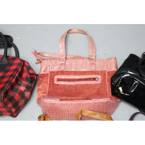 887 - Mixed lot of handbags these include multiple it luggage bags vary in size, casa di borsa pink bag an... 