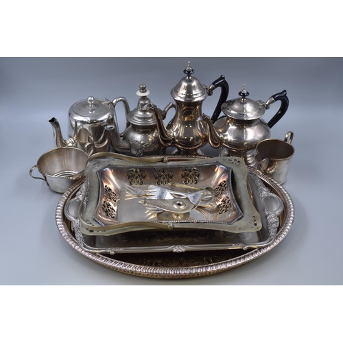 825 - A Selection of Silver Plated Ware To Include Art Deco Teapot and Coffee Pot, Various Trays, Oil Lamp... 