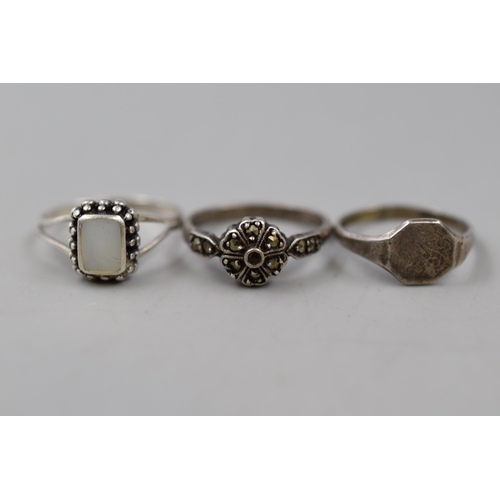 13 - A Selection of Six Silver Rings To Include Marcasite Stoned, Signet, Mother of Pearl, And More