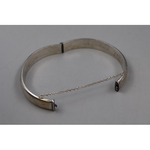 24 - A Hallmarked Birmingham Silver Bangle, With Safety Chain