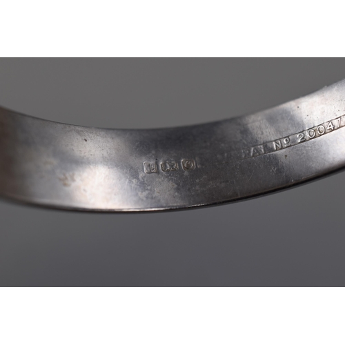 24 - A Hallmarked Birmingham Silver Bangle, With Safety Chain