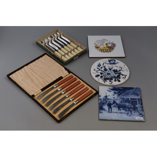 407 - Two Boxed Knife Sets anf three Ceramic Picture Tiles