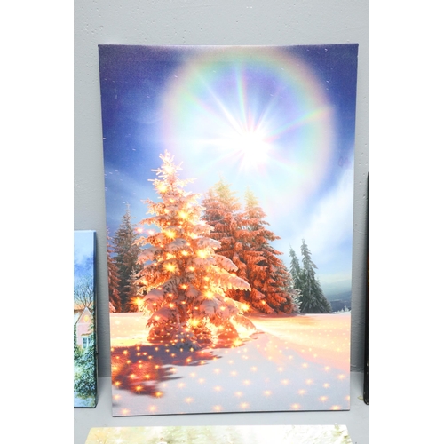 909 - Selection of light up Christmas themed canvas's (some work others flicker, as found)