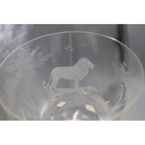 265 - Two Roland Ward, 1960s, etched crystal glasses one with stag design and one with lion design, 5.5