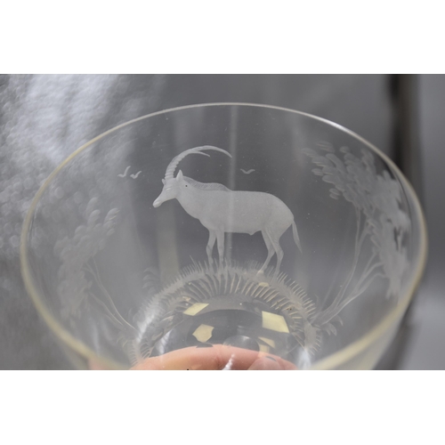 265 - Two Roland Ward, 1960s, etched crystal glasses one with stag design and one with lion design, 5.5