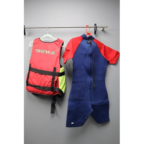 825 - An Olympic Blue and Red Wetsuit (Size Unknown), With Mesle X-Treme Life Vest