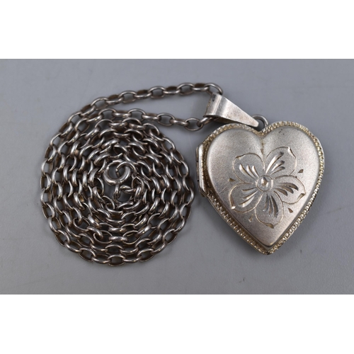 64 - A Sterling Silver Etched Floral Loveheart Locket, on Silver Belcher Chain