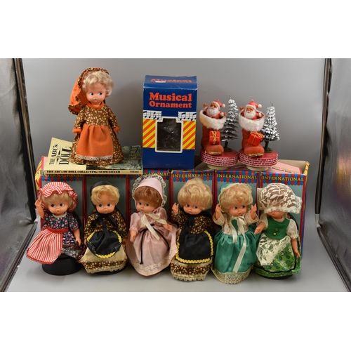 865 - Six International Musical Dolls Complete with Boxes, two Musical Christmas Ornaments and a ABC of Do... 