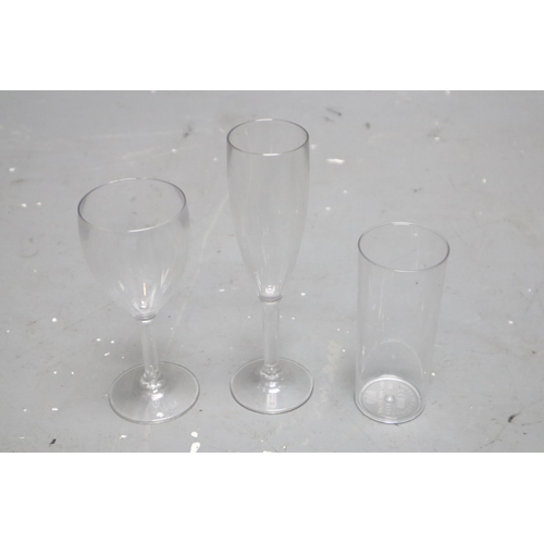 875 - A Selection of Over 250 Plastic Drinking Glasses (Wine/Champagne, And Half Pint)