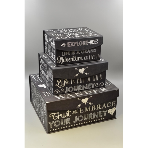 787 - Three gift boxes in different sizes in charcole grey with white writing and contents