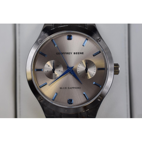 115 - A Geoffrey Beene Blue Sapphire Gents Quartz Watch, In Presentation Box. Working. Presentation Box is... 