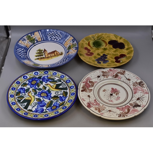 532 - Four Spanish wall plates, biggest (13