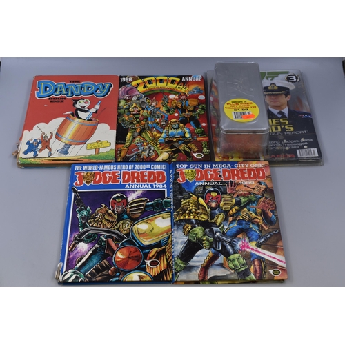 563 - Four vintage books, Judge Dread annual 1984 & 1989, 2000 AD annual 1986 and The Dandy book, also... 