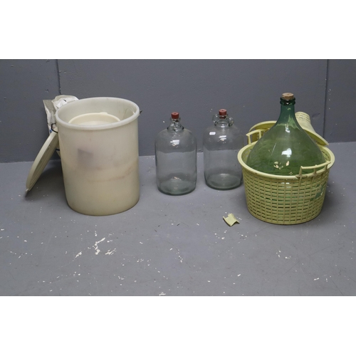 781 - A Selection of Wine Making Items To Include Two Demijohns, Carboy, Plastic Tub (Cracked Lid), Funnel... 