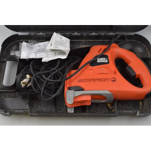 771 - A Black And Decker Scorpion 400w Multi Function Saw, In Case With Four Blades. Powers On When Tested